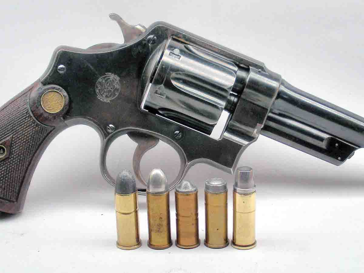 The Smith & Wesson New Century (aka Triple Lock) was introduced with the .44 S&W Special in 1906/07. Popular factory loads included (left to right): the 246-grain lead bullet, metal-capped lead bullet and wadcutter target loads. Handloaders preferred the 245-grain Lyman/Keith case semiwadcutter.